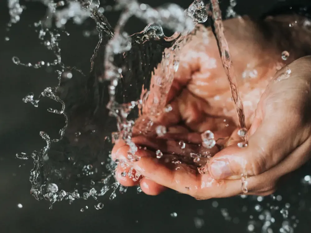 Hands in streaming wather