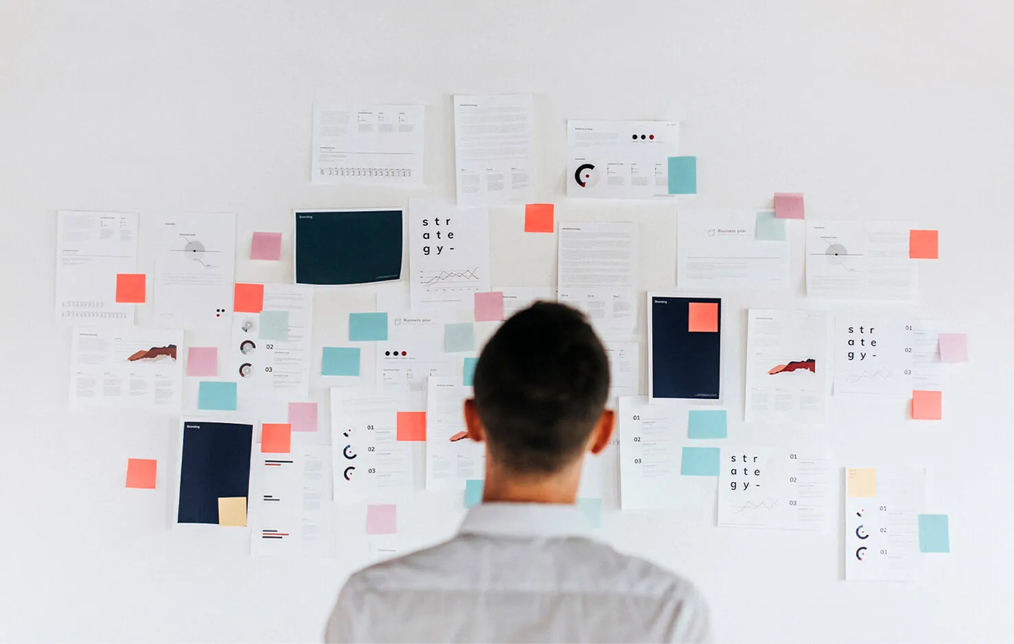 Person looking to a board with a lot of notes