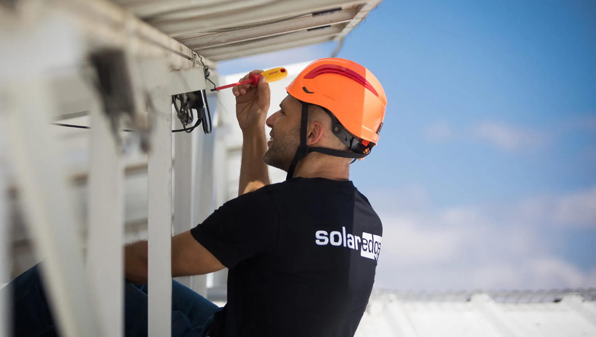 A man installing solar equipments.
